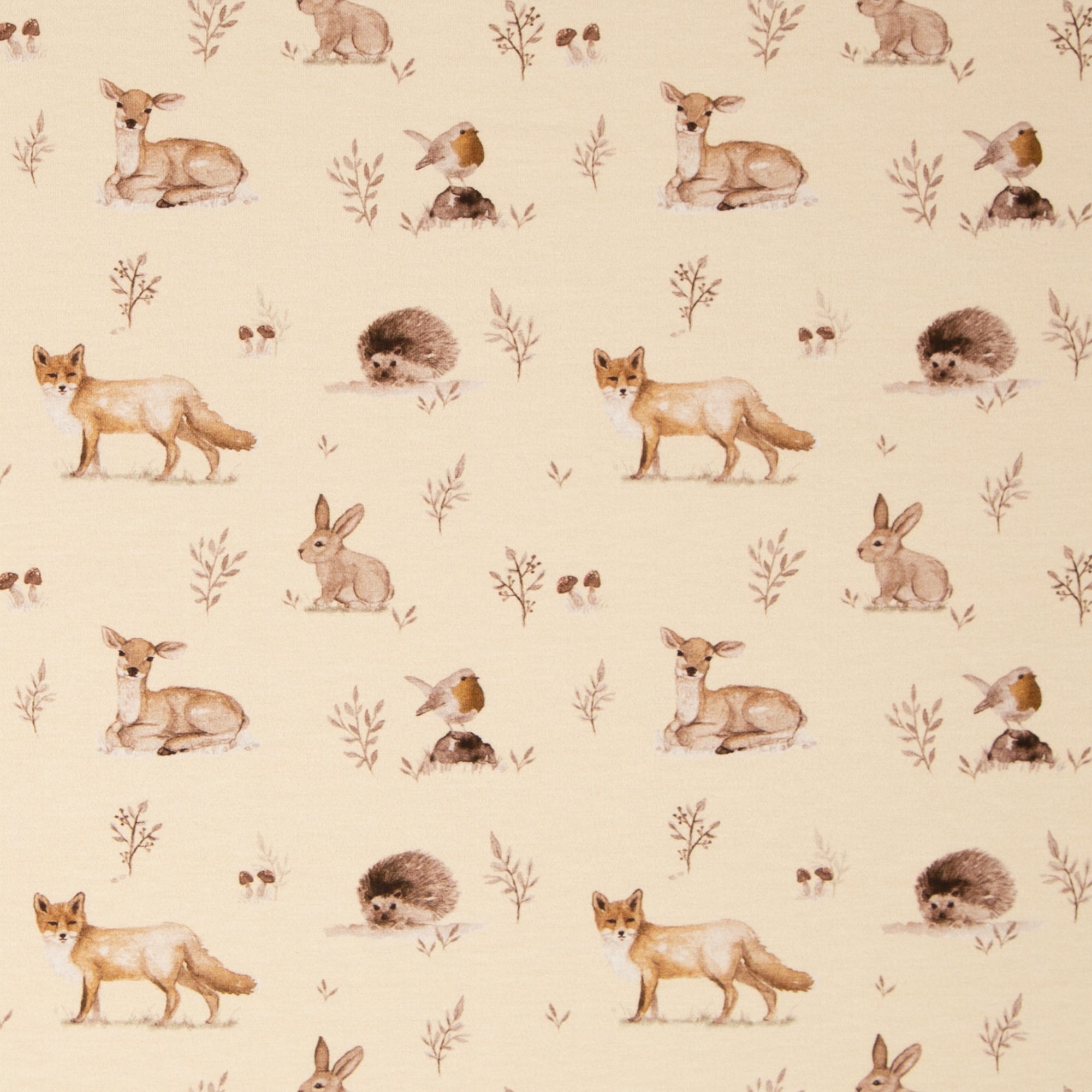 Zu sehen ist ein weicher, elastischer Baumwolljersey-Stoff in beige mit Motiven von Waldtieren wie Reh, Fuchs und Hase, der durch seine angenehme, glatte Oberfläche ideal für Kleidung, Accessoires und kreative DIY-Projekte geeignet ist.