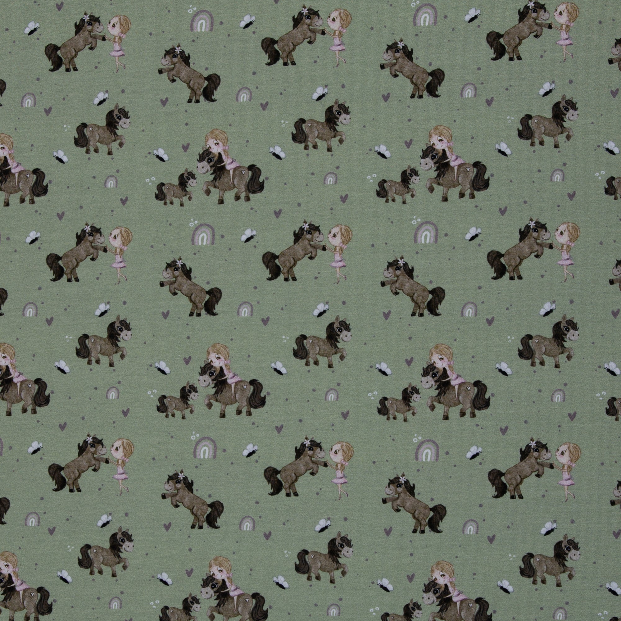 Zu sehen ist einen grünen Baumwolljerseys mit Pony- und Naturmotiven, elastisch, geeignet für Kinderkleidung und Accessoires.