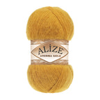 Zu sehen ist Alize Angora Gold Wolle in einem warmen Gold‑/Gelbton; weiches, leicht flauschiges Strickgarn, ideal für Pullover, Schals und kreative Handarbeitsprojekte.