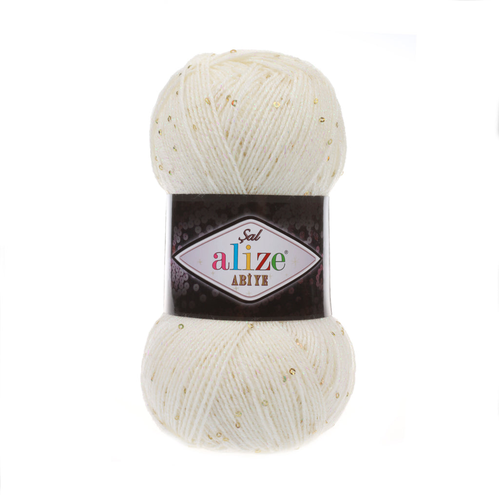 Zu sehen ist Alize Sal Abiye Wolle in einem warmen Creme‑Ton mit funkelndem Schimmer und Pailletten; ein leicht glitzerndes Garn mit Metallic‑Effekt, ideal für elegante Schals, Accessoires und besondere Handarbeitsprojekte.